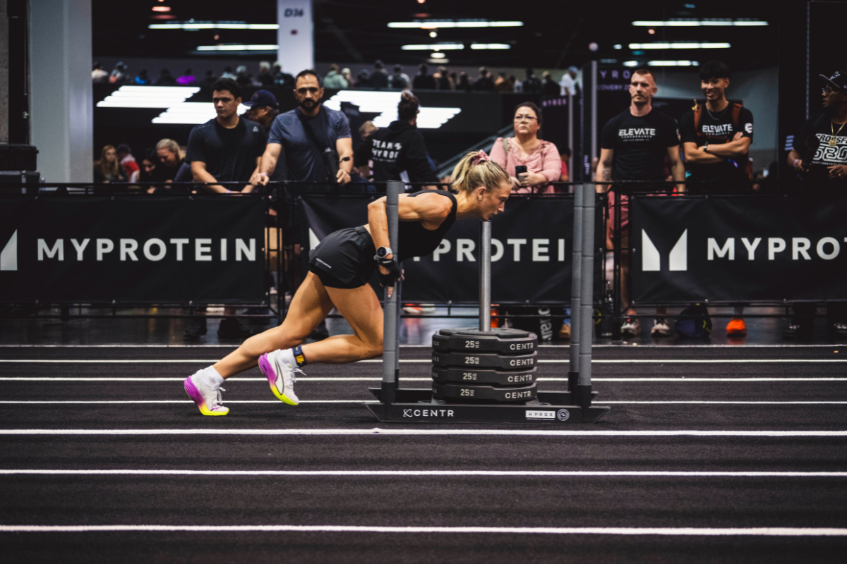 Hyrox Athlete pushing a sled