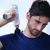 Kitta Massage Gun used on shoulder muscle