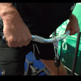 Gronk Fitness curl bar in use with cable attachment