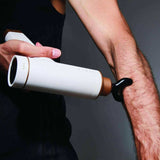 Kitta Massage Gun used on forearm muscle