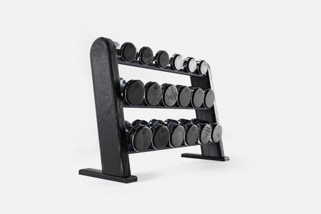 Three-tier black-stained wood rack holding nine pairs of nickel-plated dumbbells with dark end caps